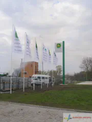 Прапори і стела.